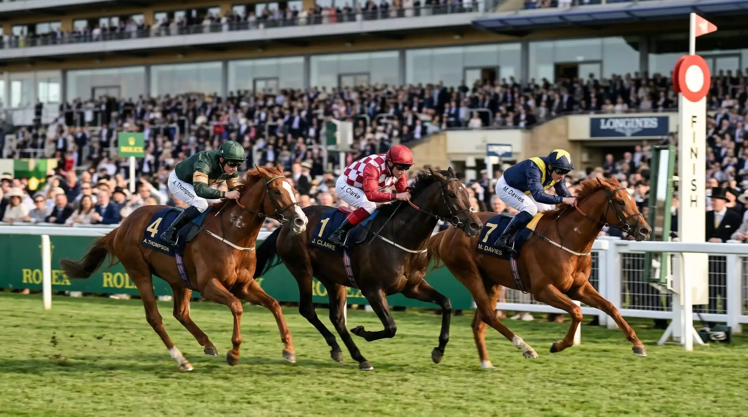 Horses racing closely for place positions at a UK racecourse